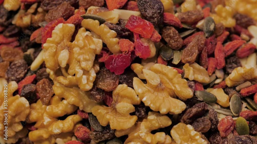 Dried fruit background. Rows of dried dates, apricots, cranberries, fruit market