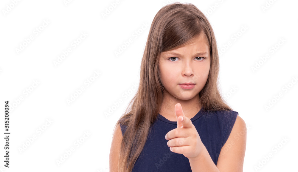 Little girl points her finger at you isolated on white background. Little girl points her finger at you isolated on white background.