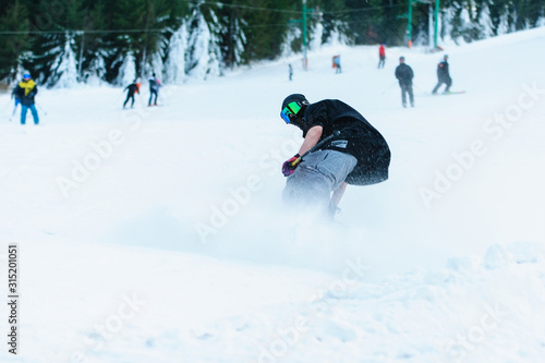 Male skier skiing on ski slope at Donovaly ski resort in Slovakia