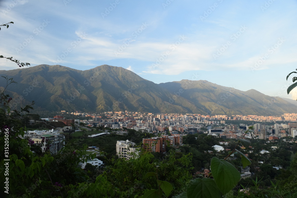 Fototapeta premium Caracas and in the background his eternal companion Cerro El Avila Waraire Repano