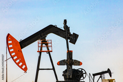 Photos Closeup details of the mechanical equipment at an oil well