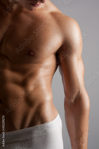 Male Fitness Model Shirtless with Defined Abs