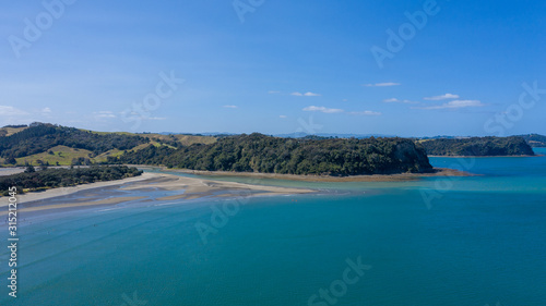 Aerial View from the Beach, Ocean, Green Trees of Wenderholm Regional Park in New Zealand - Auckland Area © Rodrigo