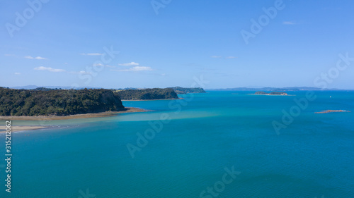 Aerial View from the Beach  Ocean  Green Trees of Wenderholm Regional Park in New Zealand - Auckland Area