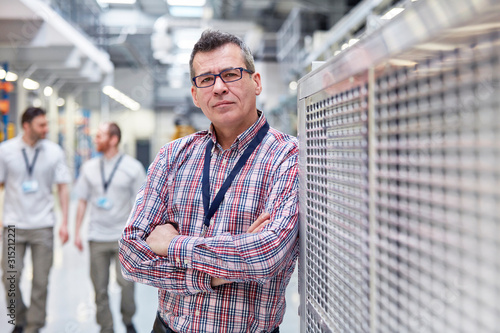 Portrait confident male supervisor in factory