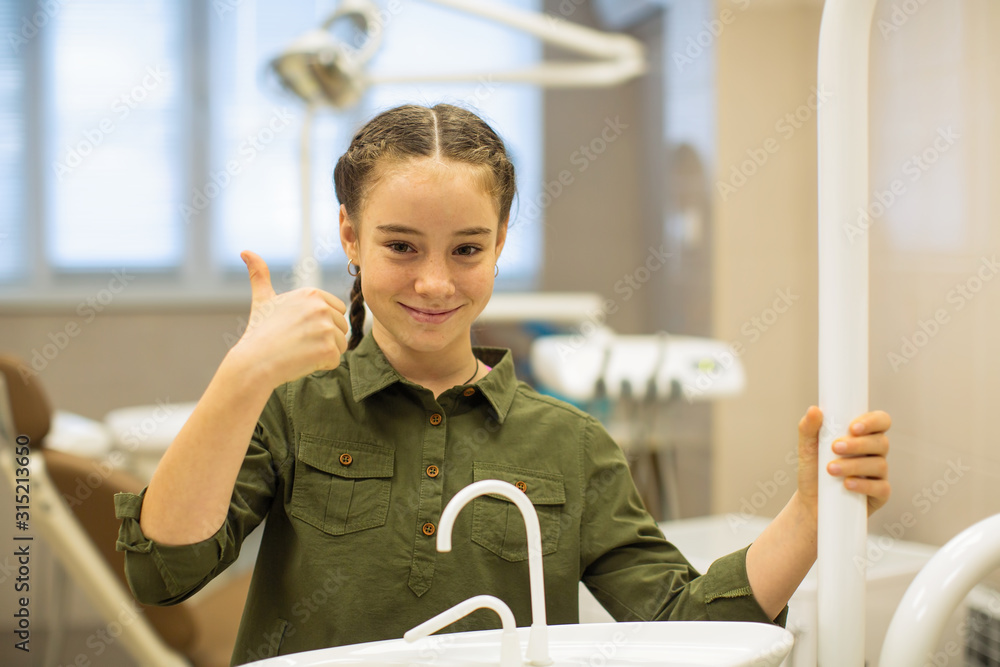 Portrait of happy child girl in the dental office. Portrait of happy child girl in the dental office.