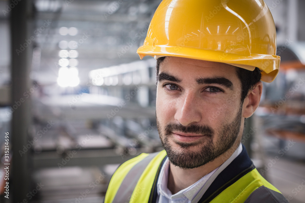 © Martin Barraud/Caia Image - Portrait confident male supervisor in factory