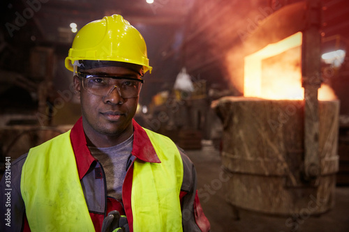 Portrait serious, confident steelworker in steel mill photo