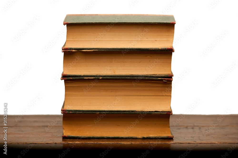 stack of old books on wooden table with white background stack of old books on wooden table with white background