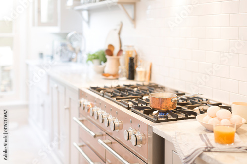 Copper pot on kitchen stove