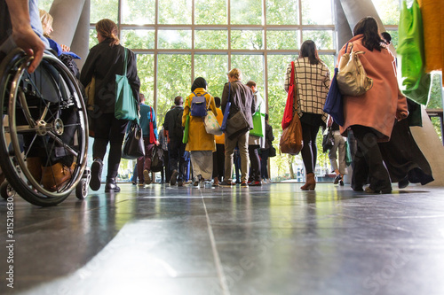 Business people leaving conference lobby