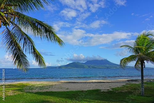 Day view of the Nevis Peak volcano across the water from St Kitts