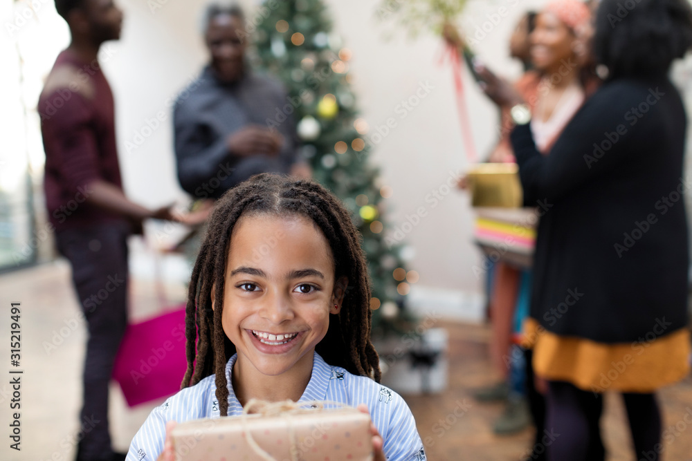Portrait smiling girl with Christmas gift Portrait smiling girl with Christmas gift