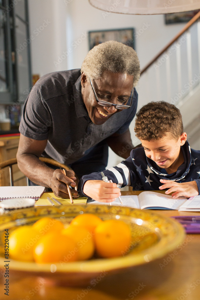 Grandfather helping grandson with geometry homework Grandfather helping grandson with geometry homework