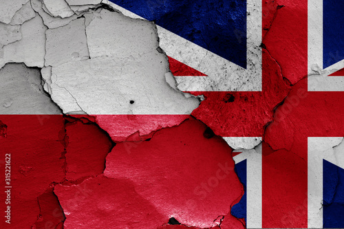 flags of Poland and UK painted on cracked wall
