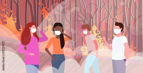 mix race people in protective masks wildfire bush fire development dry woods burning trees global warming natural disaster ecology problem concept intense smoke orange flames horizontal portrait