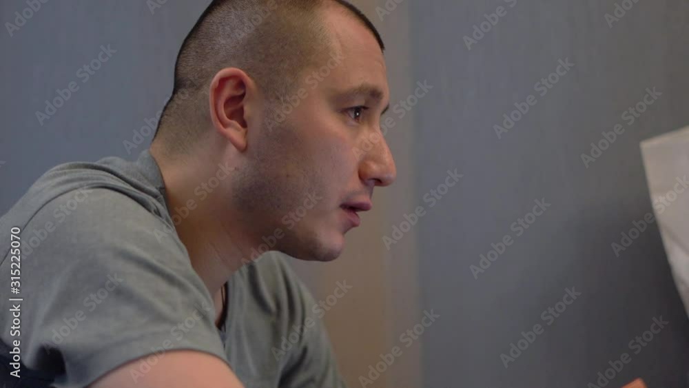 A man works hard behind his laptop. He's very upset. He's a programmer and he's not doing well. A man works hard behind his laptop. He's very upset. He's a programmer and he's not doing well.