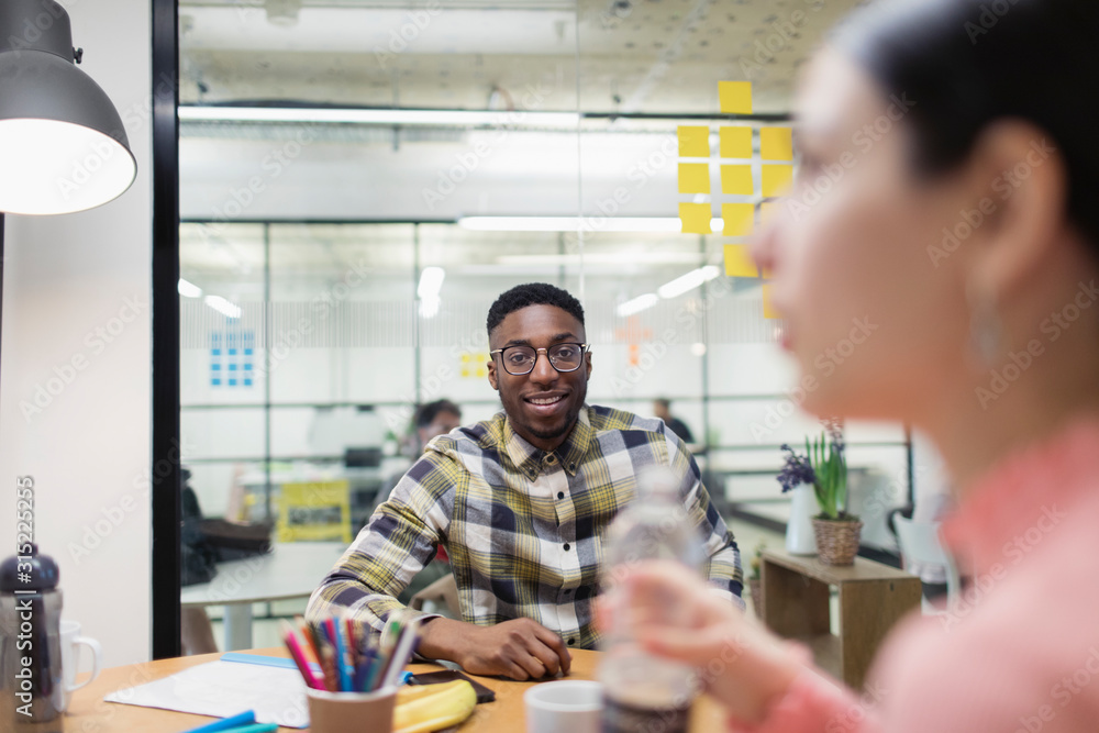 Smiling businessman in conference room meeting Smiling businessman in conference room meeting