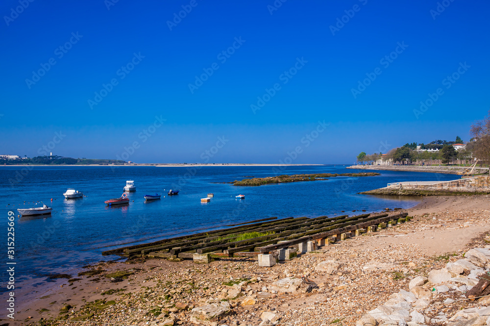 Banks of the Duero River near its mouth at Porto city in a beautiful early spring day Banks of the Duero River near its mouth at Porto city in a beautiful early spring day