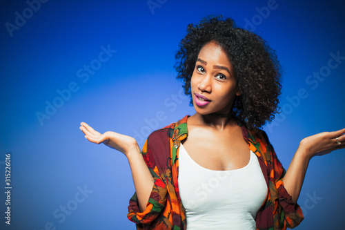 Portrait young woman shrugging