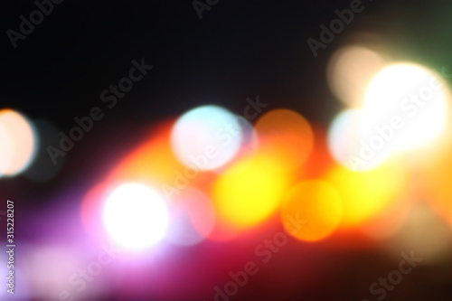 Abstract night blurred bokeh city street lights background. Out of focus bokeh.