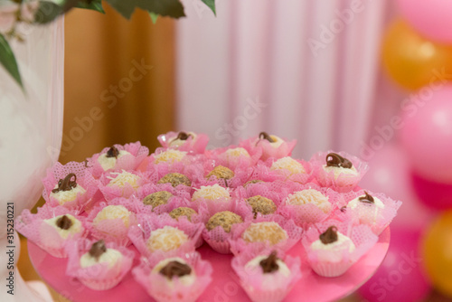Trays with many anniversary sweets typical of Brazil.