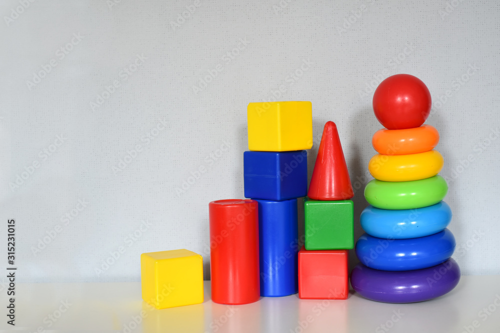 early development concept. educational toys for children cubes, blocks, pyramid. baby toys collection isolated on white background. early development concept. educational toys for children cubes, blocks, pyramid. baby toys collection isolated on white background.