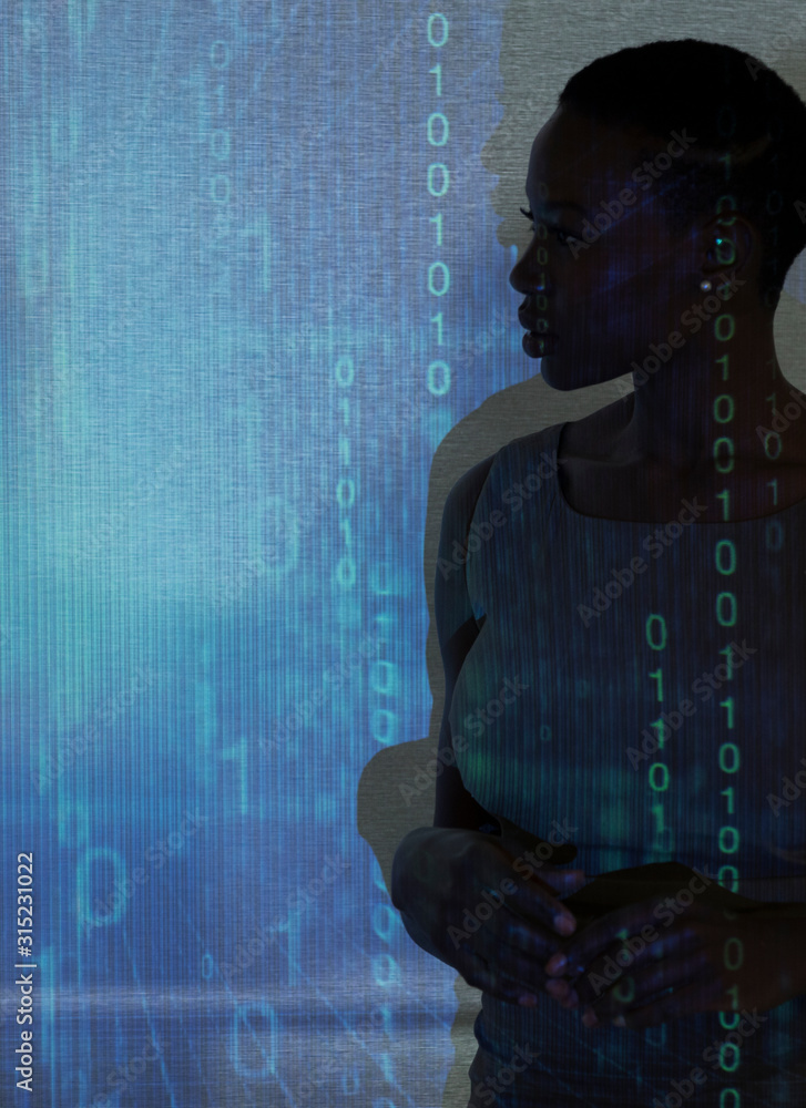 © Tom Merton/Caia Image - Silhouette of businesswoman against binary code on projection screen