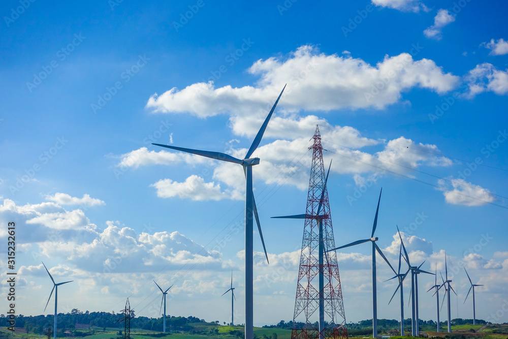 Fototapeta premium Wind turbine with blue sky. Wind energy. Clean energy