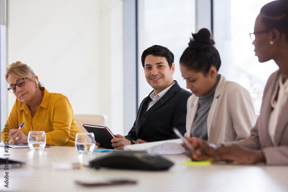 Portrait confident businessman in conference room meeting Portrait confident businessman in conference room meeting