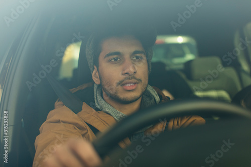 Young man driving car