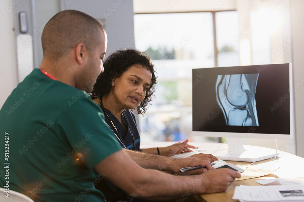 Nurses discussing digital x-ray in clinic Nurses discussing digital x-ray in clinic
