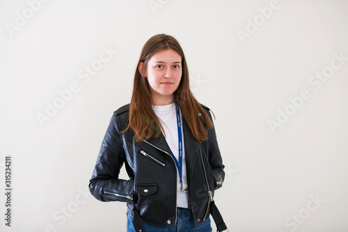 Portrait confident young woman wearing leather jacket