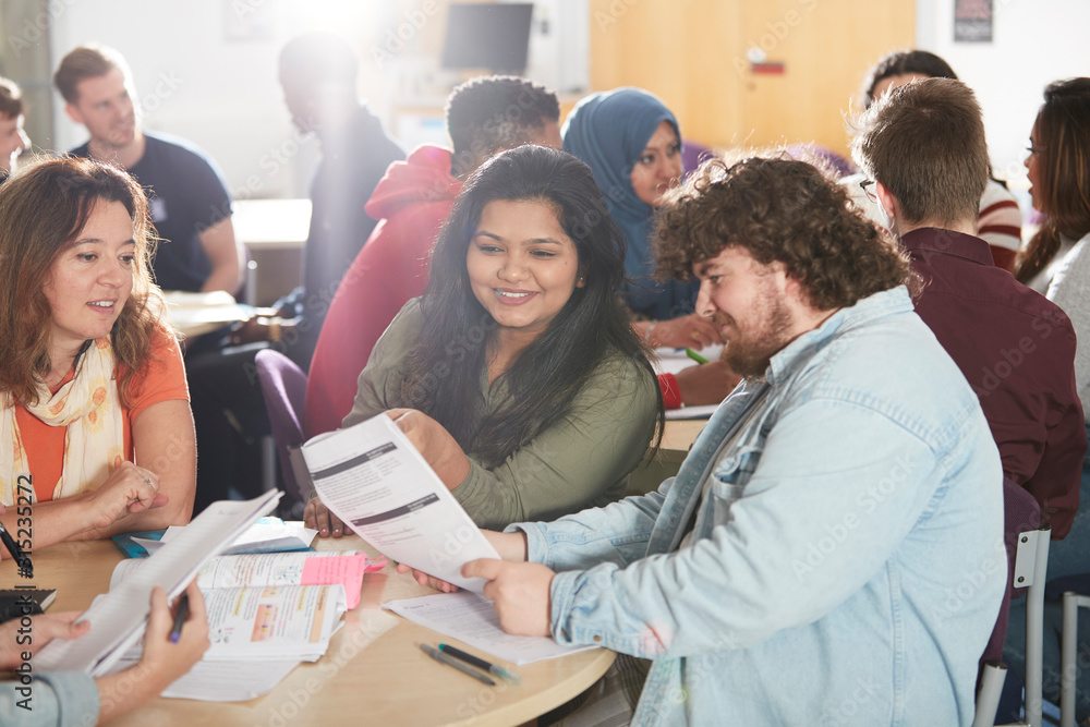 College students studying together in classroom College students studying together in classroom