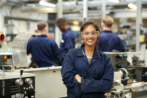 Portrait confident young female college student in shop class photo