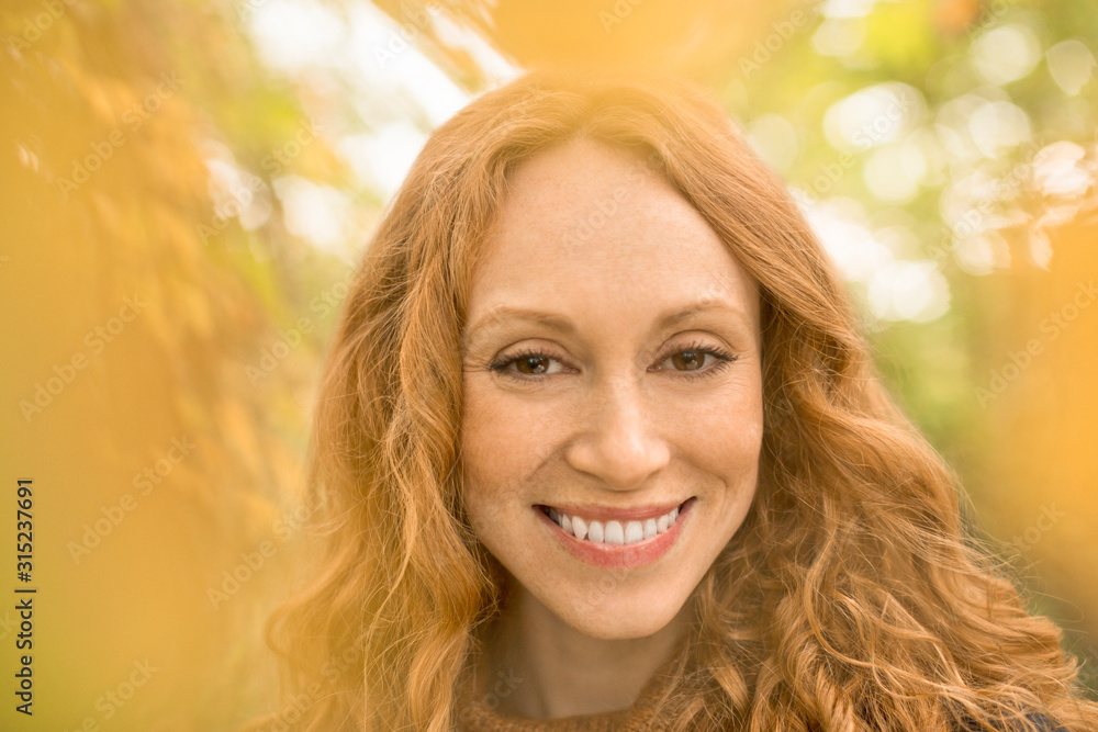 Close up portrait smiling woman with red hair Close up portrait smiling woman with red hair