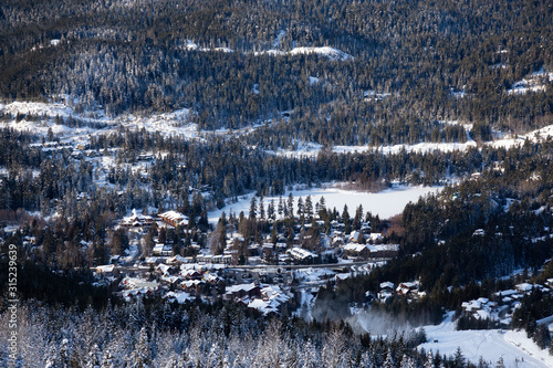 View from above of Creekside Village during a sunny winter day. Taken from Whistler Mountain, British Columbia, Canada. photo