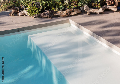 Sunny reflection over swimming pool
