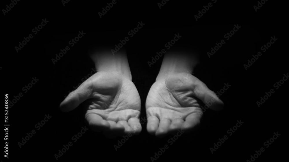 Open hands up in the dark. Open hands up in the dark.