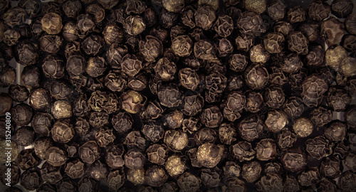 Canvas Print Black pepper seeds in full screen.