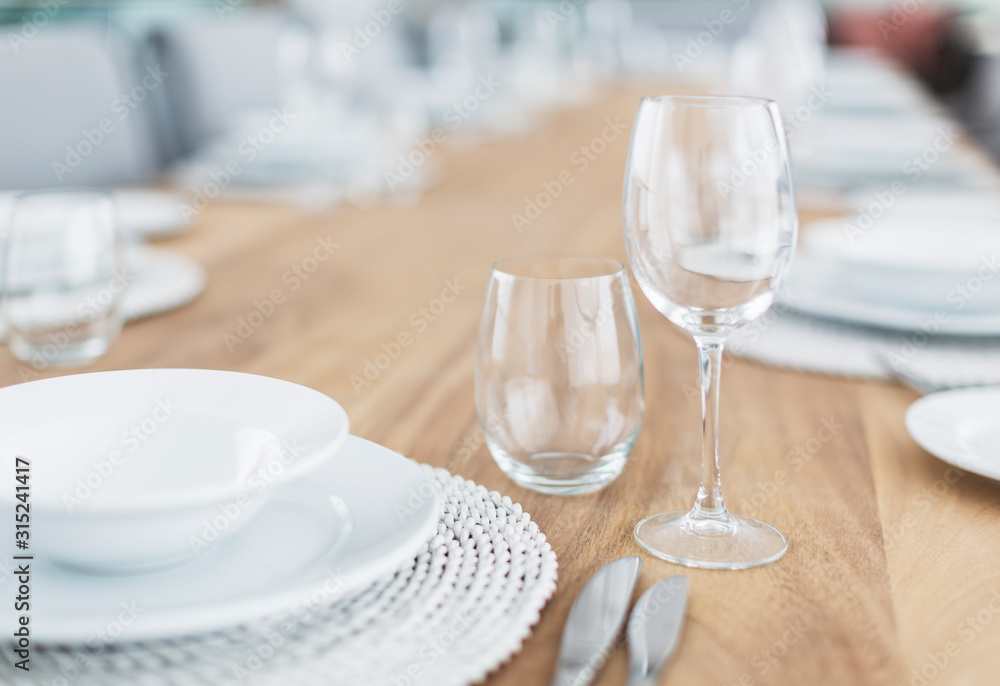 Still life simple placesetting on wood dining table Still life simple placesetting on wood dining table