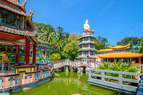 Chinese Pagoda and Pavilion by the Lake at Haw Par Villa Theme Park. This park has statues and dioramas scenes from Chinese mythology, folklore, legends, and history.