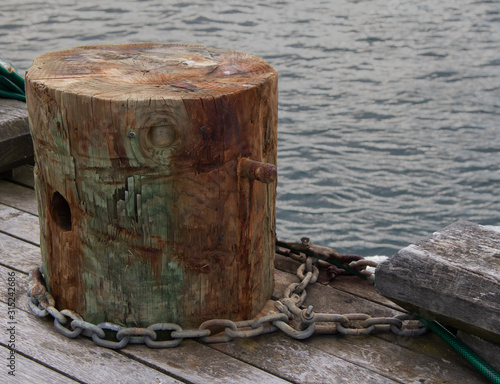 Wooden bollard in harbour