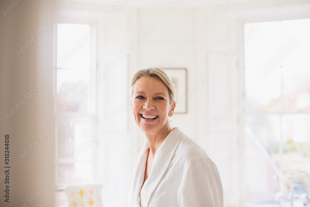 Portrait smiling, confident mature woman in bathrobe Portrait smiling, confident mature woman in bathrobe