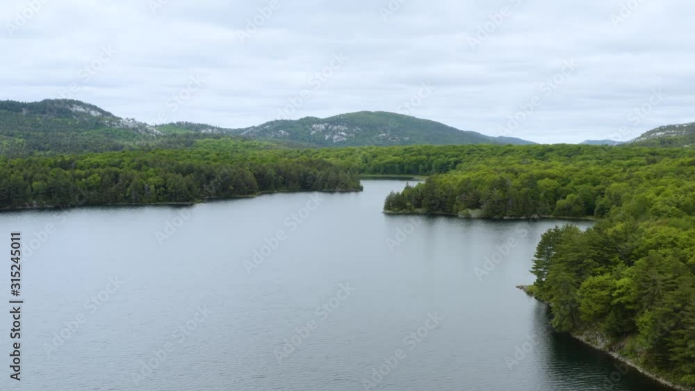 Fresh water lake and mountain 4K Aerial Drone Footage Fresh water lake and mountain 4K Aerial Drone Footage