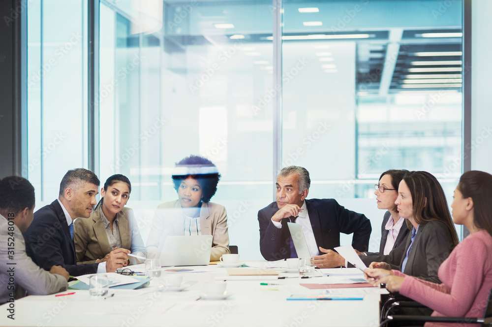 Business people talking in conference room meeting Business people talking in conference room meeting