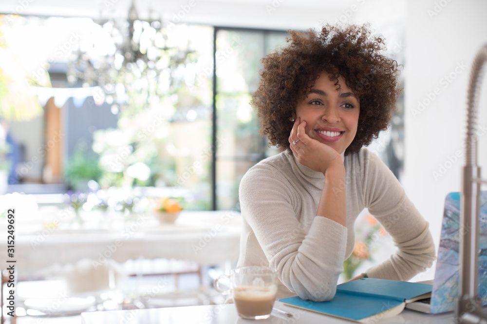 Smiling confident young female freelancer working at laptop Smiling confident young female freelancer working at laptop