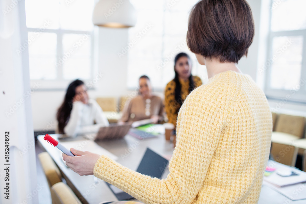 Businesswoman leading conference room meeting Businesswoman leading conference room meeting