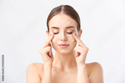 Beautiful woman massaging h...