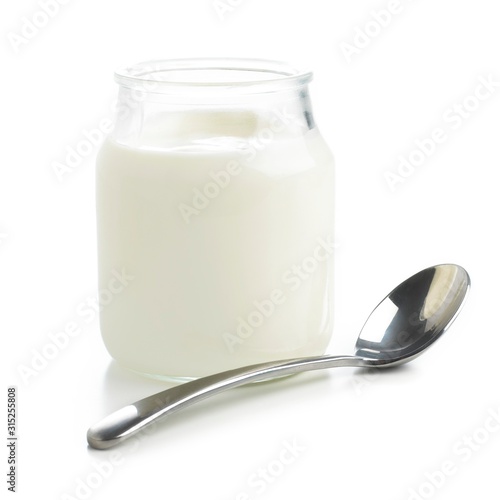 Jar of fresh yoghurt and spoon photo